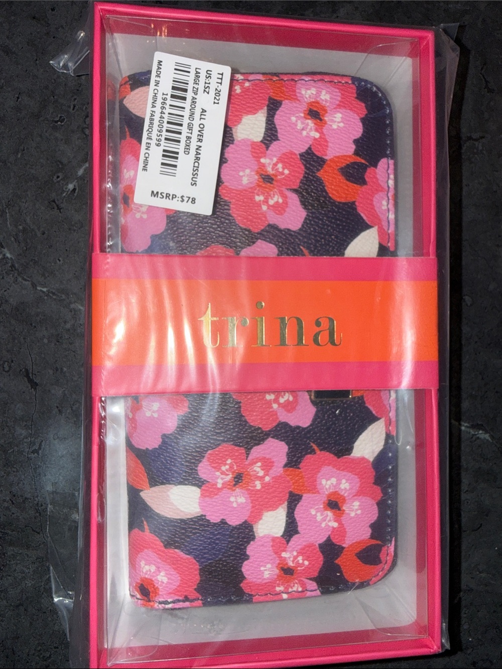 Trina Turk Pink Floral Zip-Around Wallet with Purple Background